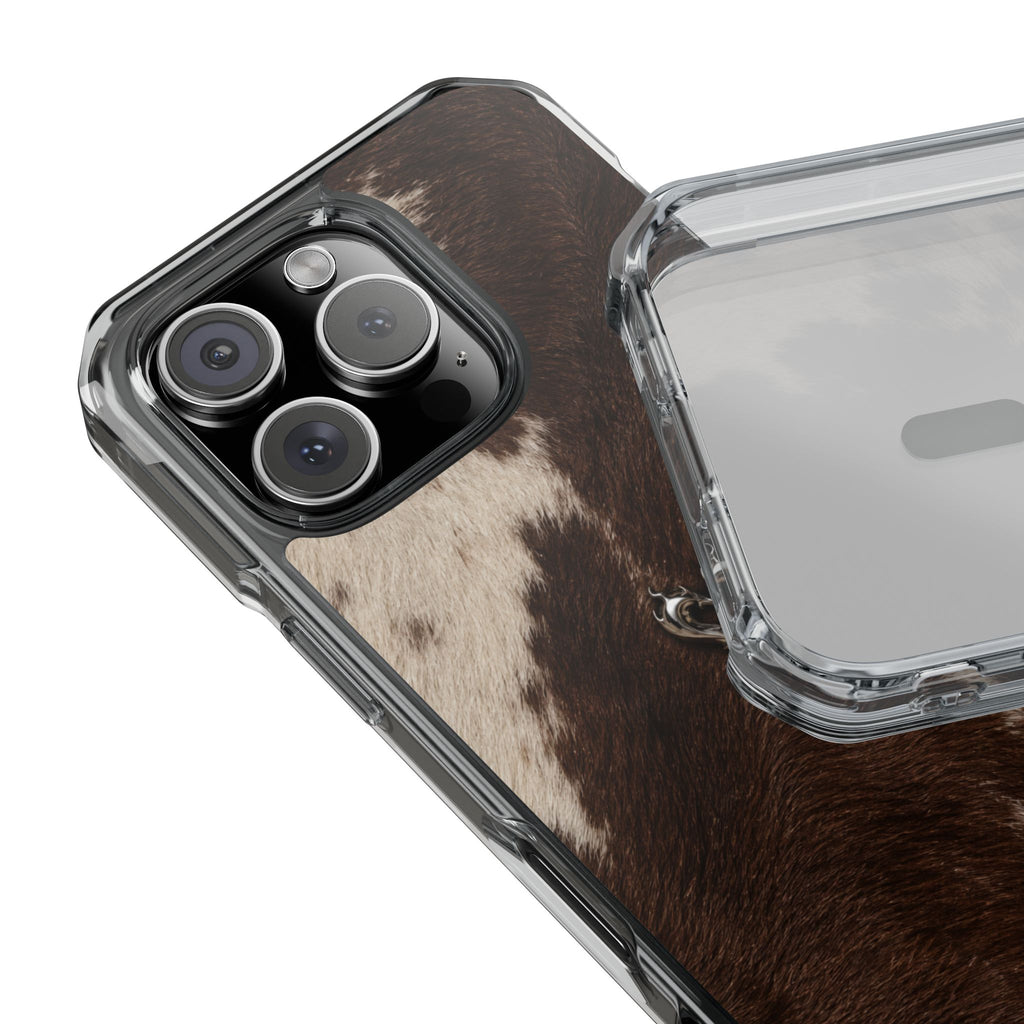 A close-up of a smartphone case with a brown and beige cowhide pattern, shown attached to a phone alongside a transparent hard shell case on a white background.