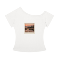 A white short-sleeve scoop-neck t-shirt featuring a square graphic print on the chest depicting a scenic sunset landscape with mountains and a lake.