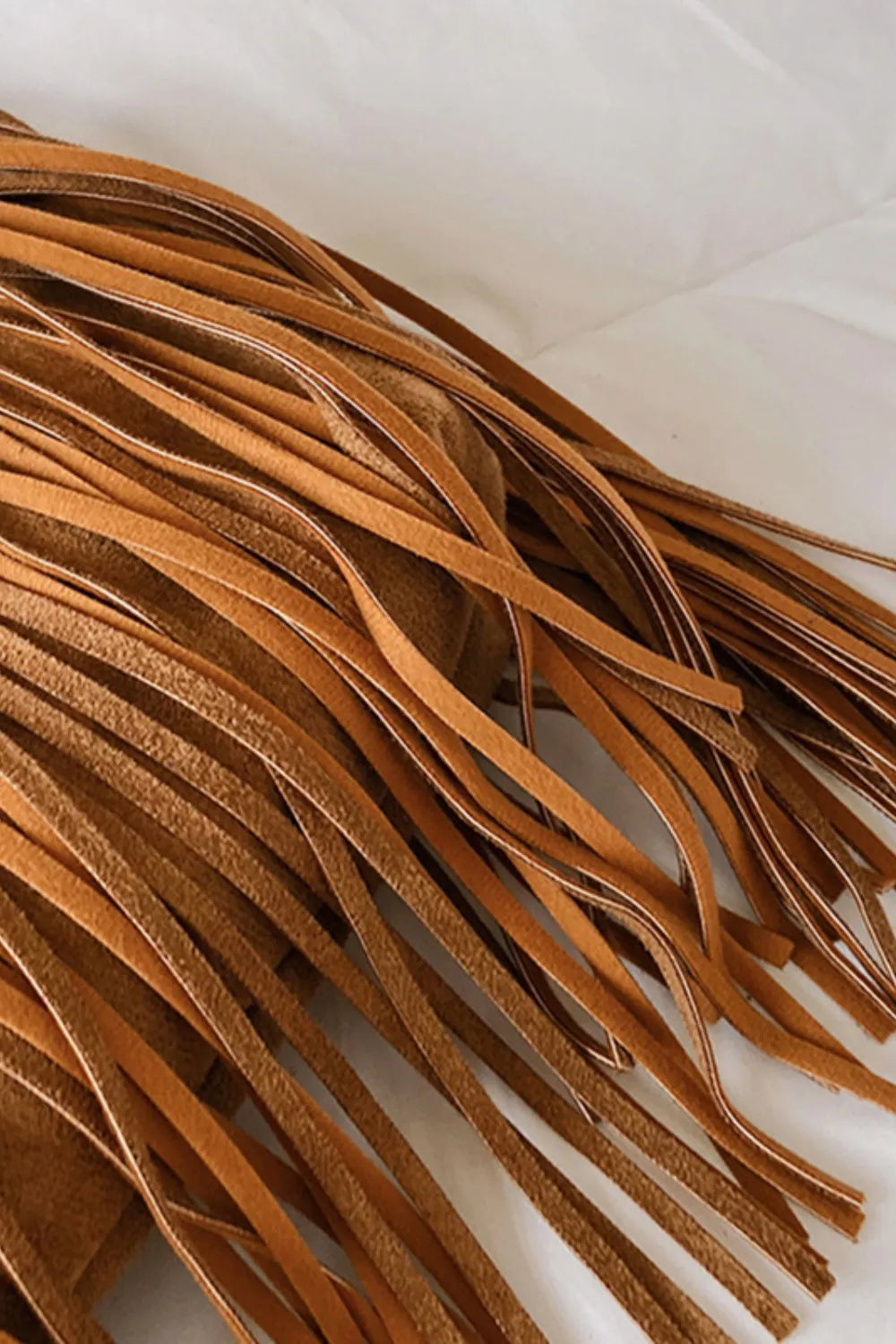 Brown leather strips on a white background