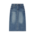 Blue denim skirt on a white background