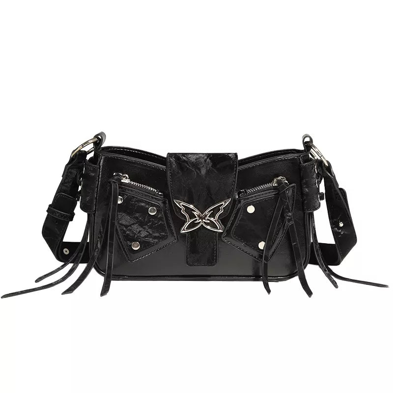 Black leather handbag with butterfly design on a white background