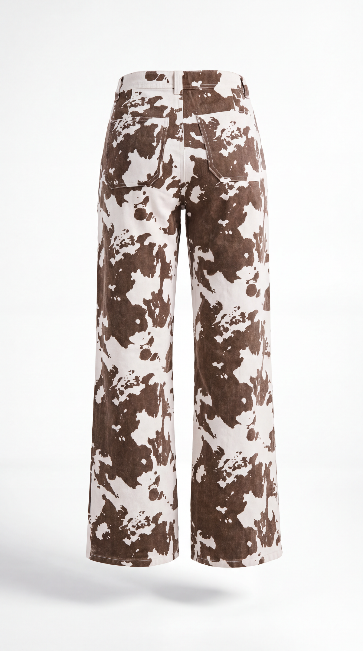 A pair of wide-leg cropped pants featuring a brown and off-white cow print pattern, shown from the back on a white studio background.